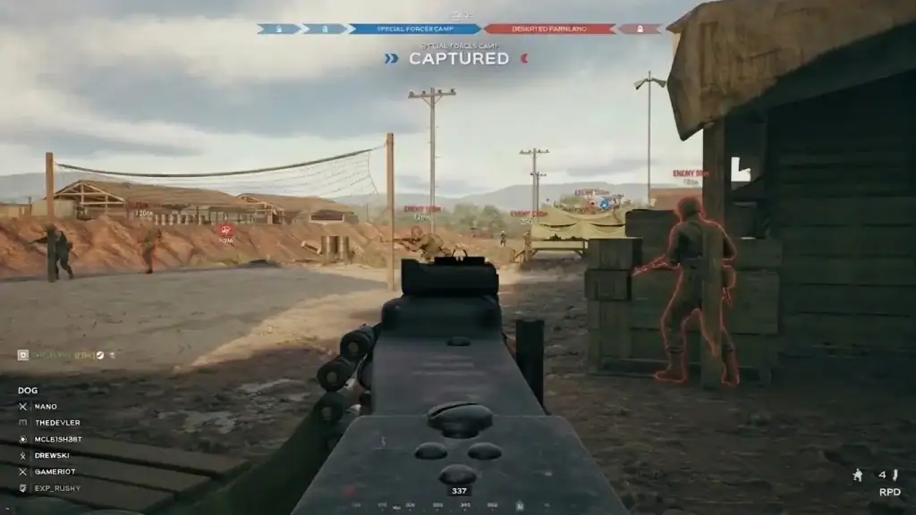 Hell Let Loose Vietnam Cheats: Aimbot, ESP & EAC-Ready First-person view of a military shooter game with a gun aiming at enemies in a desert setting.